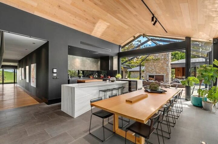 Tiled open kitchen and dining space with outdoor or indoor functionality in Melbourne Australia.