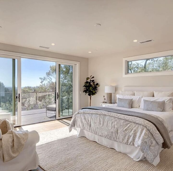 Realestate Napa Valley, California, USA. Master bedroom with views and balcony entrance.