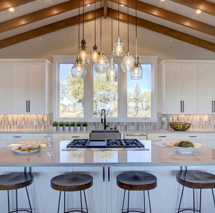 Realestate Napa Valley, California, USA. Open kitchen dining area with exposed beams and views.