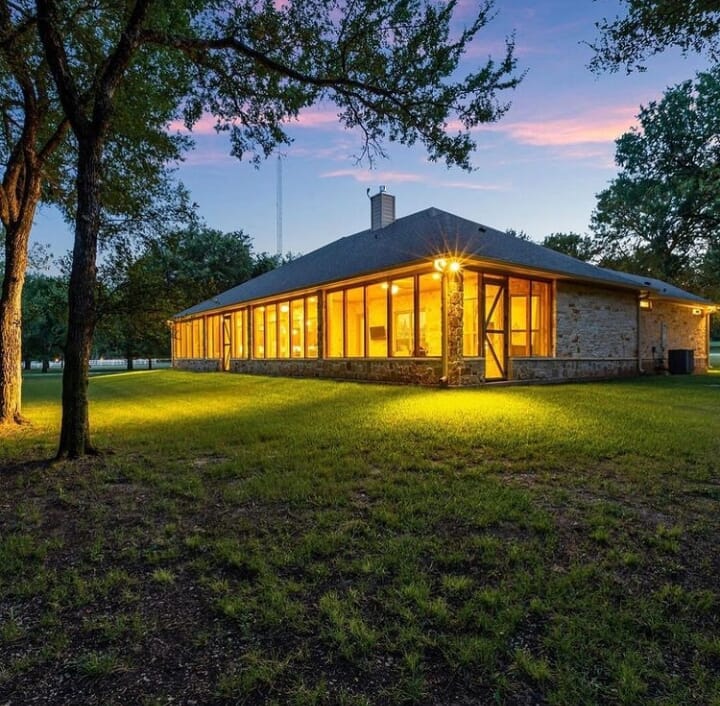 Realestate in China Spring, Texas, USA. Outside of house at night time with lights on